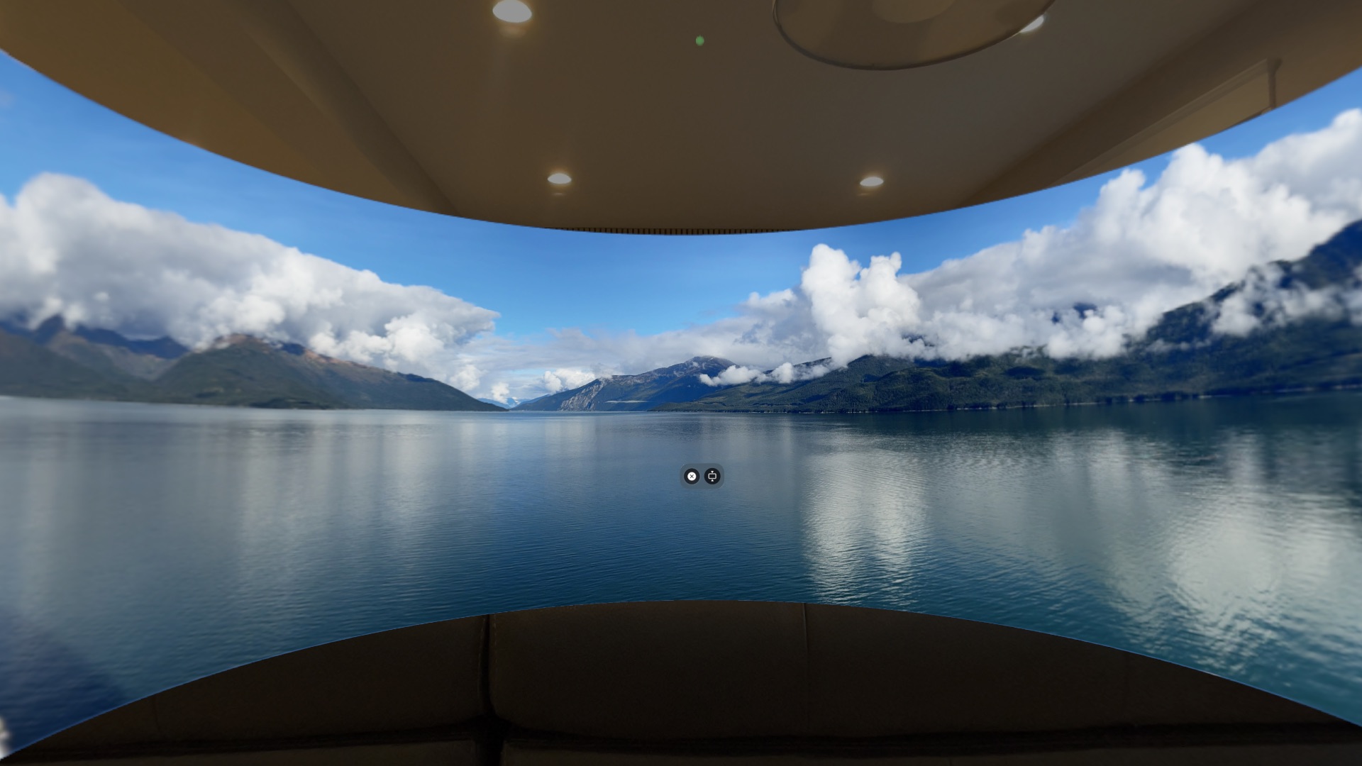 Panoramic photo of a lake and mountains displayed as immersive cylindrical arc on Apple Vision Pro